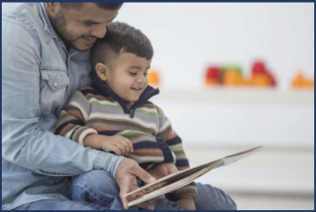 a father reading to his child